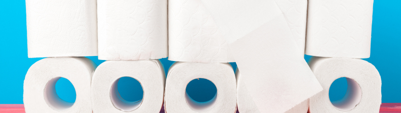 toilet-paper-stack-on-bright-blue-background-2021-09-04-04-57-14-utc 1